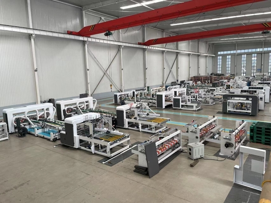 Macchina per la cucitura automatica di cartone ondulato