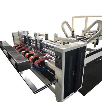 Macchina automatica per incollaggio e cucitura di scatole di cartone ondulato